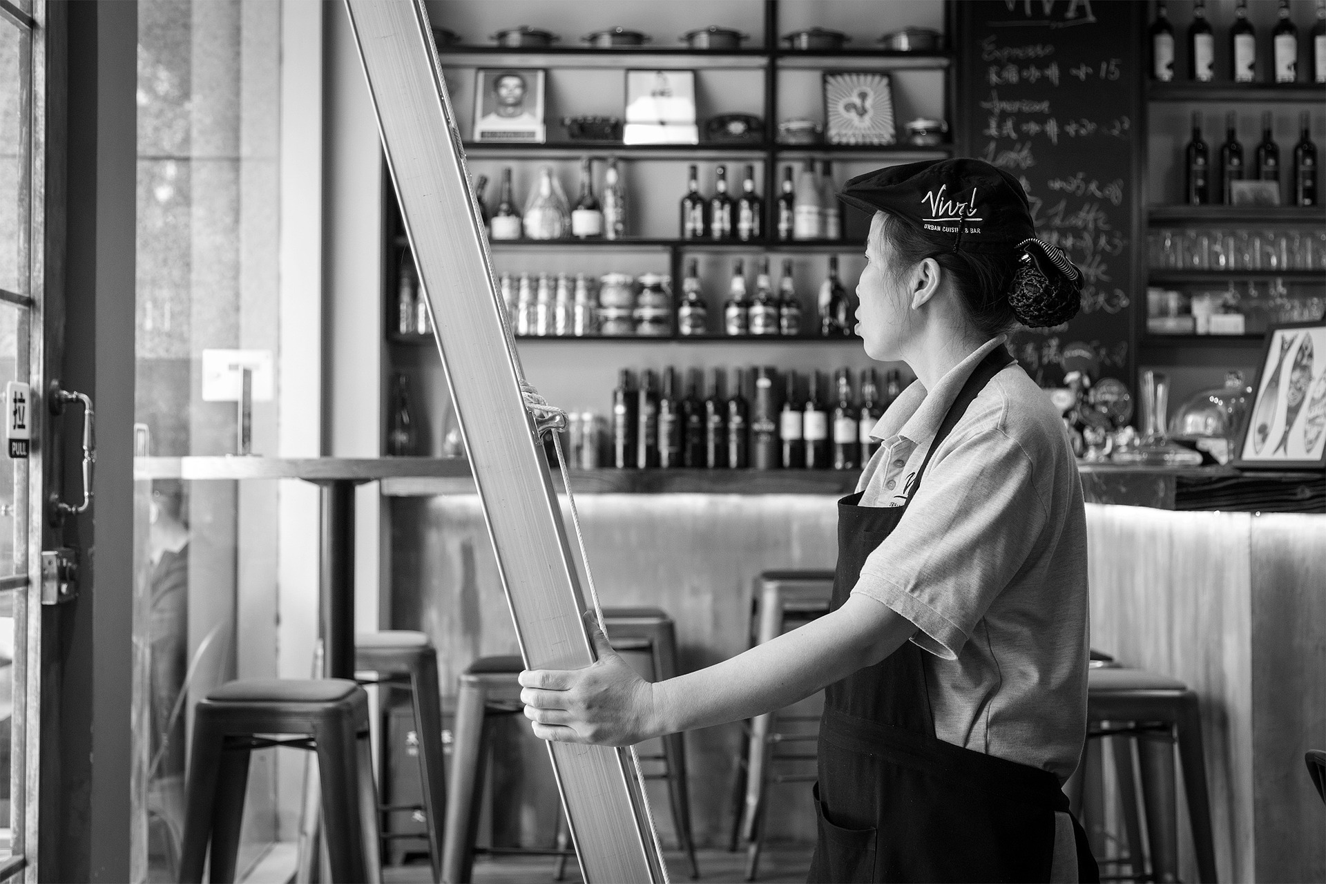 A hospitality professional opening up for the day